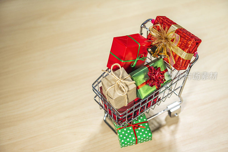 Looking down on a shopping cart full of wrapped gifts – Concept online shopping